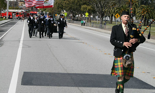 A bagpiper in a parade